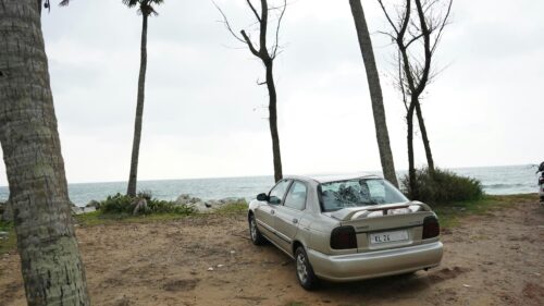 Suzuki Baleno Sedan Parked Near Ocean Coast PC Wallpaper