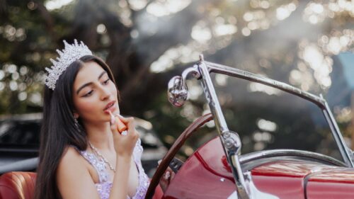 Beautiful Beauty Queen Applying Lipstick in Classic Red Car 4K Wallpaper