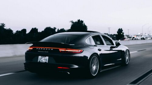 Black Porsche Panamera Turbo Driving on Highway 4K Wallpaper