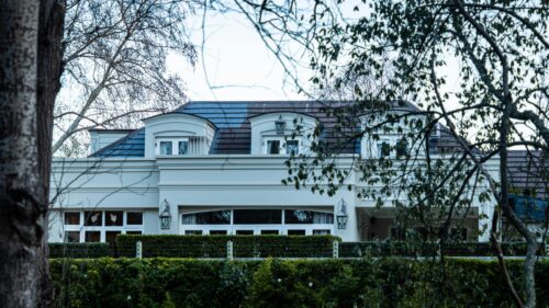 Luxury Mansion Exterior with Dormer Windows Desktop Wallpaper
