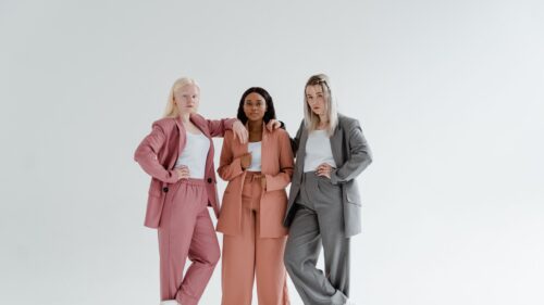 Diverse Women in Stylish Pastel and Gray Suits 4K Desktop Wallpaper