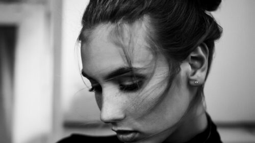 Beautiful Moody Portrait of a Young Woman in Black and White Desktop Wallpaper