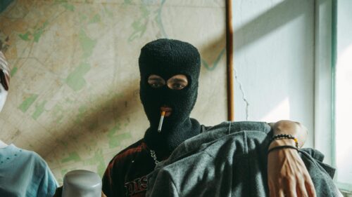 Edgy Street Style Person in Balaclava Smoking 4K Desktop Wallpaper