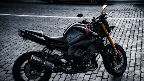 Black Yamaha FZ1 Naked Sportbike on Cobblestone Street 4K Wallpaper