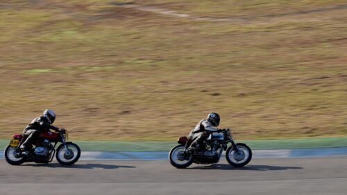 Vintage Cafe Racer Motorcycles Racing on Track 4K Wallpaper