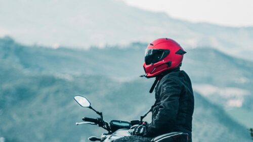 Biker in Red Helmet Mountain View 4K Desktop Wallpaper