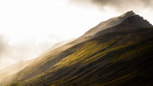 Sunlit Icelandic Mountain Peak Scenic Landscape 4K Wallpaper