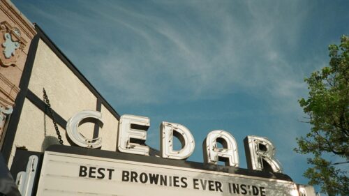 Retro Cedar Theater Cinema Sign with Best Brownies Text 4K Wallpaper
