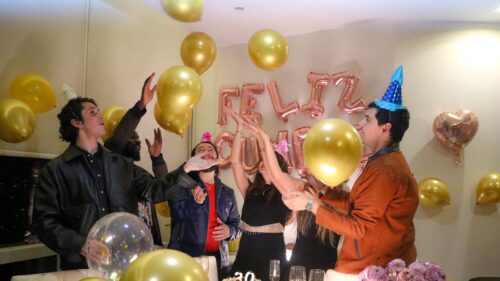 Friends Celebrating Birthday Party with Gold Balloons Desktop Wallpaper