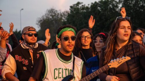 Youth Music Festival Energy with Guitarist and Friends 4K Wallpaper