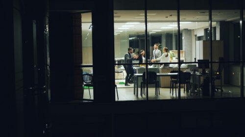 Corporate Office Team Celebrating Success Late at Night 4K Wallpaper