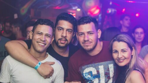 Group of Friends Having Fun at a Vibrant Nightclub 4K Wallpaper