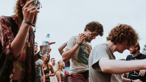 Group of Friends Dancing at Summer Music Festival 4K Desktop Wallpaper