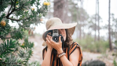 Woman Photographer with Vintage Film Camera in Nature Desktop Wallpaper