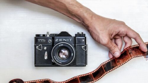 Zenit TTL Film Camera and Developed Negatives 4K Wallpaper