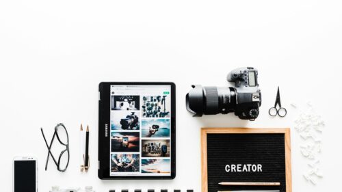 Creative Photography Desk Setup with Camera and Tablet 4K Wallpaper