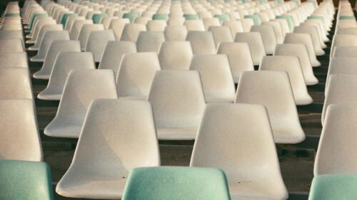 Rows of Minimalist Empty Stadium Seats 4K Desktop Wallpaper
