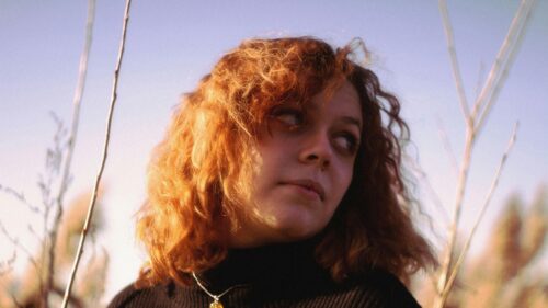 Stunning Golden Hour Portrait of Woman with Curly Red Hair 4K Wallpaper