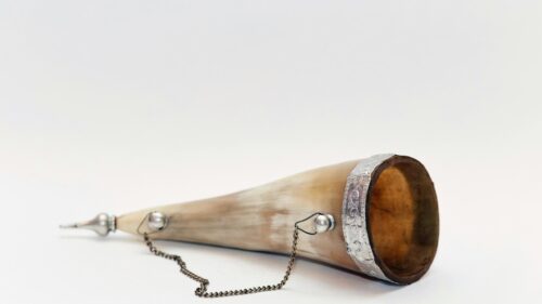 Antique Powder Horn with Ornate Silver Detailing Desktop Wallpaper