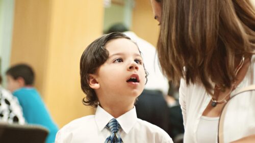 Little Boy Wearing Tie Talking to Mother 4K Desktop Wallpaper
