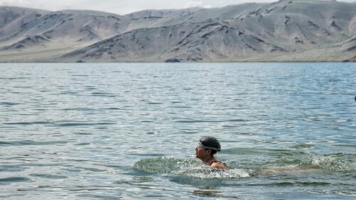 Swimmer in Crystal Clear Mountain Lake Landscape Desktop Wallpaper