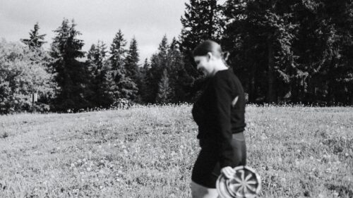 Woman Walking in a Meadow with Dandelions Desktop Wallpaper