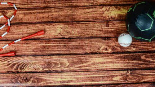 Sports Gear on Rustic Wood Background 4K Desktop Wallpaper