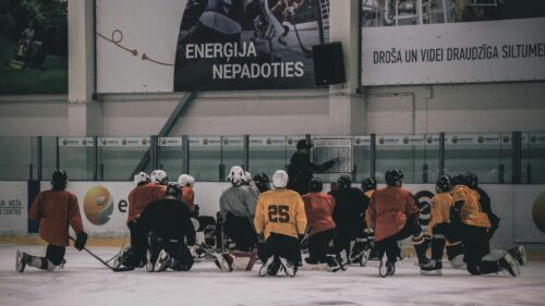 Ice Hockey Coach Teaching Strategy to Team Desktop Wallpaper