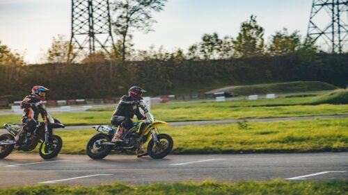 Supermoto Racing Riders on Track Action 4K Wallpaper