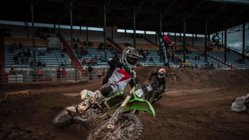 Motocross Racers Leaning into a Corner 4K Desktop Wallpaper