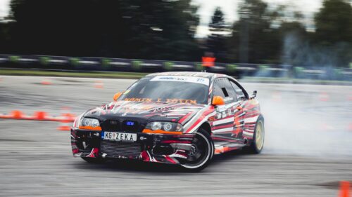 BMW Drift Car Racing on Asphalt Track 4K Desktop Wallpaper