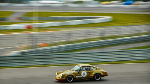 Vintage Gold Porsche 911 Racing on Track 4K Desktop Wallpaper