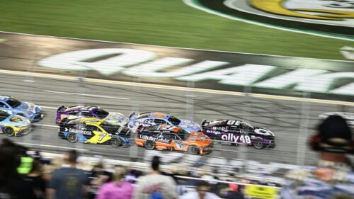 High-Speed NASCAR Cup Series Pack Racing Action Desktop Wallpaper