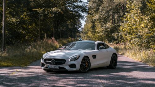 White Mercedes-AMG GT Sports Car on Forest Road 4K Wallpaper