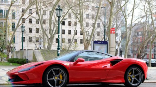 Stunning Red Ferrari F8 Tributo in Lisbon Cityscape 4K Wallpaper