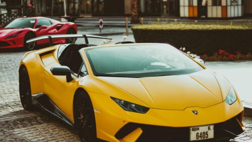 Yellow Lamborghini Huracan Spyder and Red Ferrari 4K Desktop Wallpaper