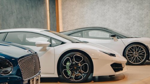 Luxury Exotic Supercars in Showroom 4K Desktop Wallpaper