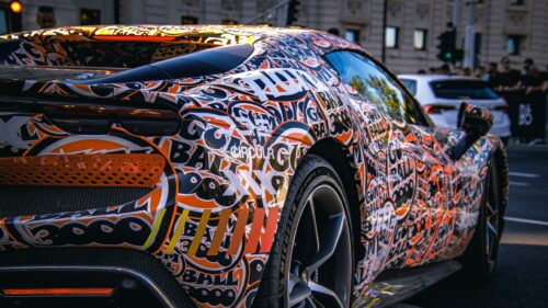 Custom Ferrari Supercar With Vibrant Graffiti Wrap 4K Wallpaper