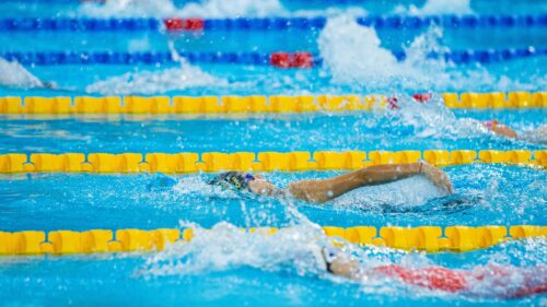Competitive Backstroke Swimmer in Action 4K Wallpaper