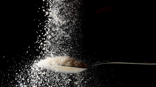 Macro Close-up of Sparkling White Sugar Crystals Texture Background 4K Wallpaper