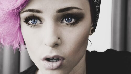 Stunning Portrait of a Woman with Pink Hair and Blue Eyes 4K PC Wallpaper