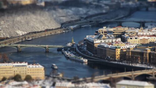 Aerial View of Snowy Prague Cityscape with Vltava River 4K Wallpaper