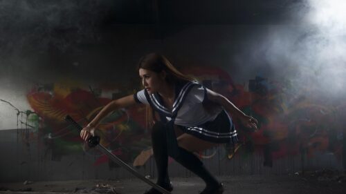 Anime Schoolgirl with Samurai Katana Sword in Gritty Graffiti Room 4K Wallpaper