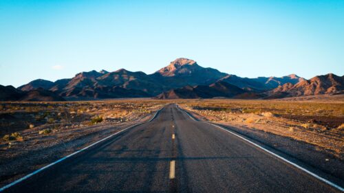 Stunning Desert Highway Road Leading to Mountains PC Wallpaper