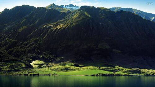 Stunning Mountain Range Overlooking Serene Lake Landscape PC Wallpaper