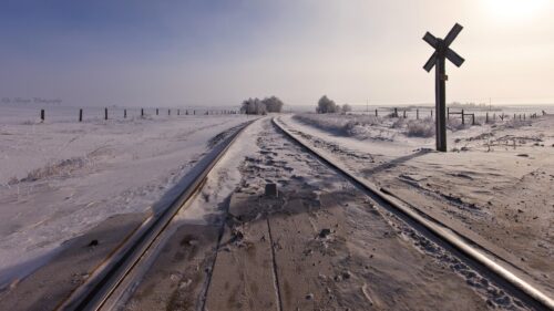 Frozen Winter Railway Tracks in Snowy Landscape Desktop Wallpaper
