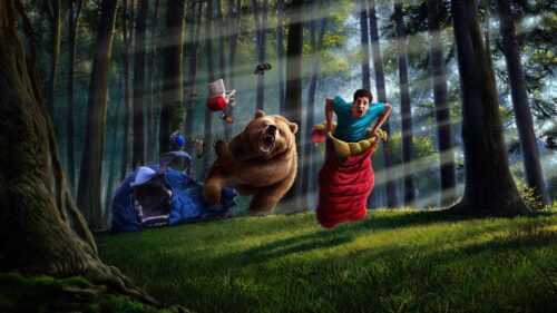 Terrified Man Running From a Grizzly Bear in Forest PC Wallpaper