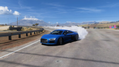 Blue Audi R8 Sports Car Drifting on Scenic Mountain Road 4K Wallpaper