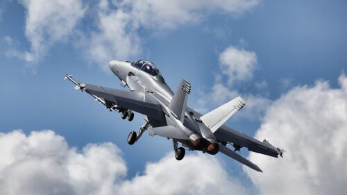US Navy F/A-18 Super Hornet Jet Fighter Ascending in Blue Sky PC Wallpaper