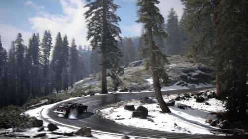 Classic Muscle Car Drifting on Snowy Mountain Road 4K Wallpaper
